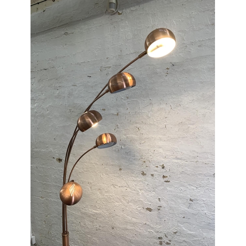 82 - A modern brushed copper effect five light floor lamp - approx. 213cm high