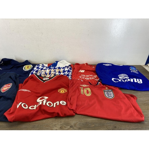 472 - A collection of football shirts to include England, Arsenal, Everton, Crewe Alexandra etc.