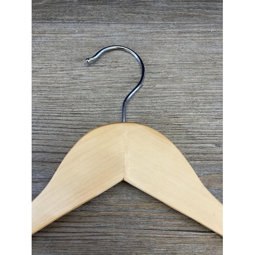 473 - A quantity of wooden clothes hangers