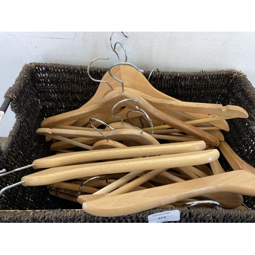 473 - A quantity of wooden clothes hangers