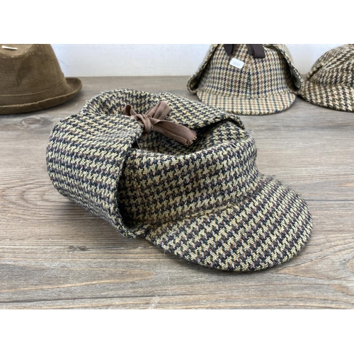 481 - Six vintage men's hats comprising two Dunn & Co. Harris Tweed deer stalkers and four trilbies