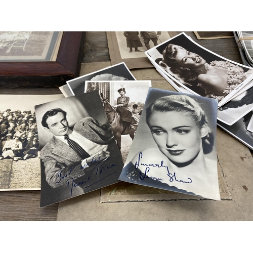 498 - A collection of antique and later black and white photographs and postcards