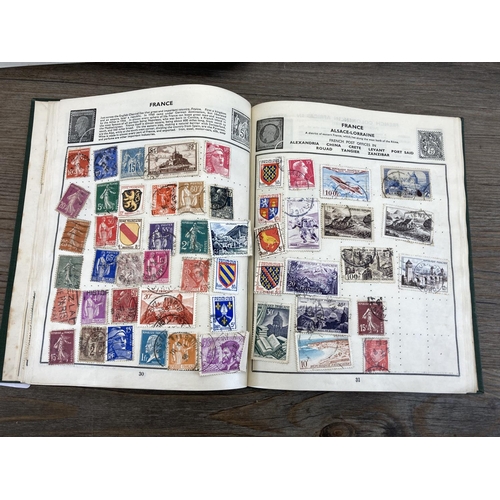 499 - Five stamp albums containing a collection of worldwide stamps