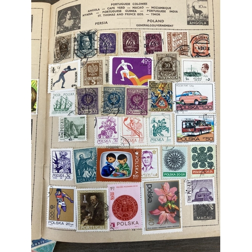 502 - Five stamp albums containing a collection of worldwide stamps