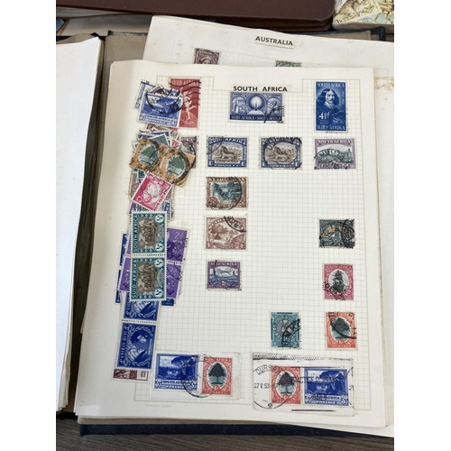 502 - Five stamp albums containing a collection of worldwide stamps