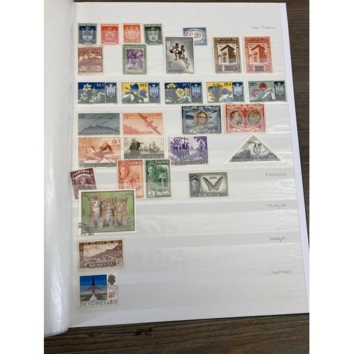 504 - Five stamp albums containing a collection of worldwide stamps