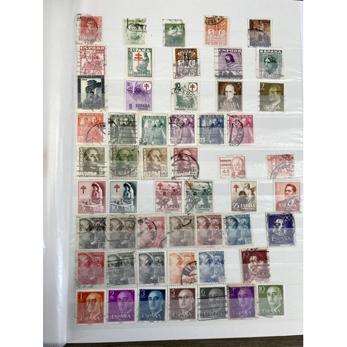 504 - Five stamp albums containing a collection of worldwide stamps