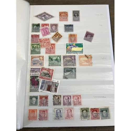 504 - Five stamp albums containing a collection of worldwide stamps