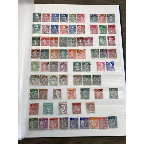 504 - Five stamp albums containing a collection of worldwide stamps