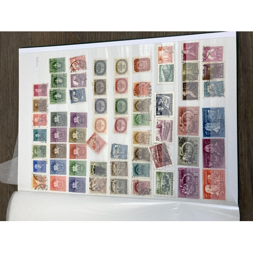 504 - Five stamp albums containing a collection of worldwide stamps