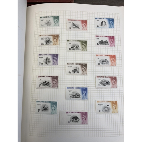 508 - Six stamp albums containing a collection of worldwide stamps