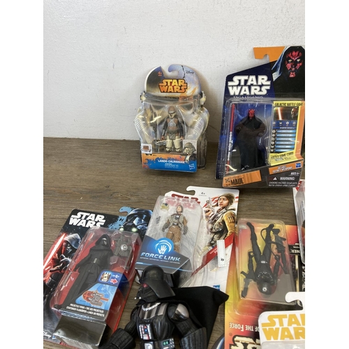 458 - A large collection of boxed and unboxed Star Wars figurines to include Saga Legends Darth Maul, The ... 