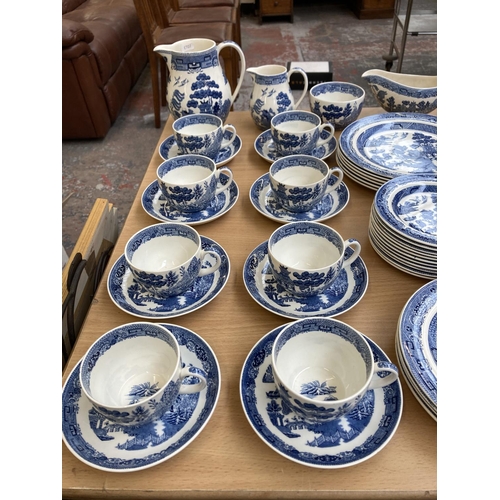 392 - A collection of Wedgwood Willow dinnerware to include twelve cups, eight saucers, milk jug, sugar bo... 