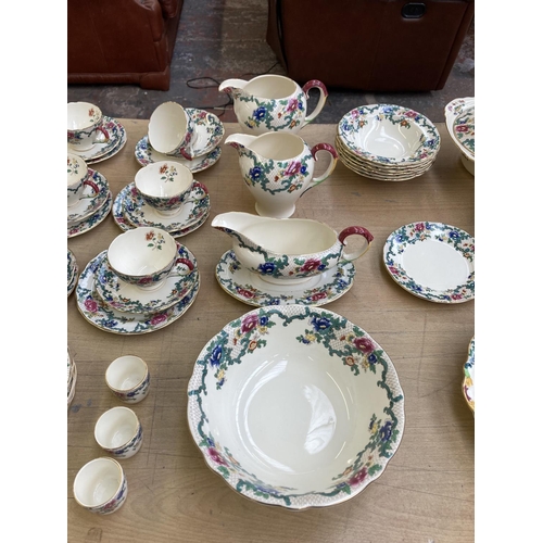 393 - A collection of Royal Cauldon Victoria dinnerware to include six cups, saucers and side plates, two ... 