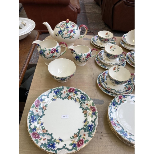 393 - A collection of Royal Cauldon Victoria dinnerware to include six cups, saucers and side plates, two ... 