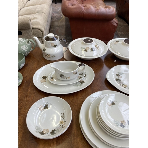 394 - A collection of Royal Doulton Westwood dinnerware to include three cups and saucers, two tureens, co... 