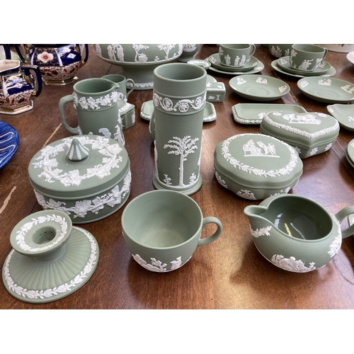 395 - A collection of Wedgwood sage green Jasperware to include teapot, coffee pot, circular pedestal bowl... 