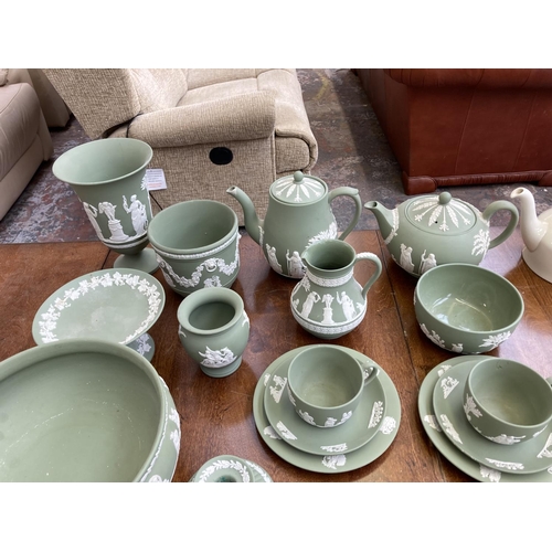 395 - A collection of Wedgwood sage green Jasperware to include teapot, coffee pot, circular pedestal bowl... 