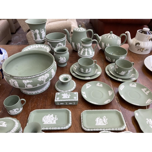 395 - A collection of Wedgwood sage green Jasperware to include teapot, coffee pot, circular pedestal bowl... 