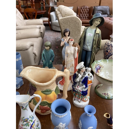 396 - A collection of items to include two Wedgwood pale blue Jasperware vases, Willow Tree With My Grandm... 