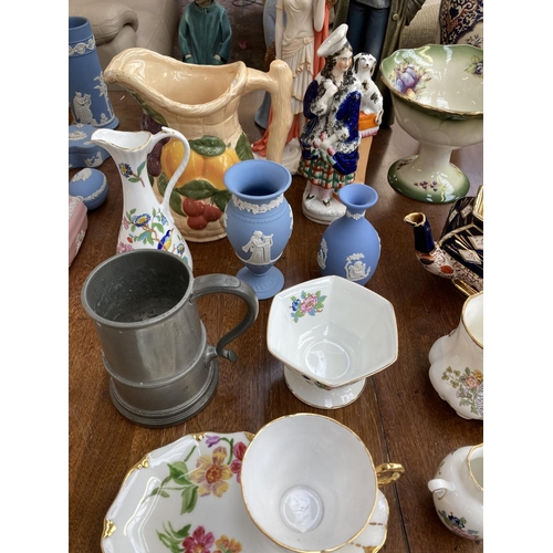 396 - A collection of items to include two Wedgwood pale blue Jasperware vases, Willow Tree With My Grandm... 