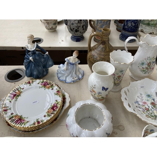 402 - A collection of ceramics to include two Royal Doulton figurines, Fragrance HN2334 and Marjorie HN278... 