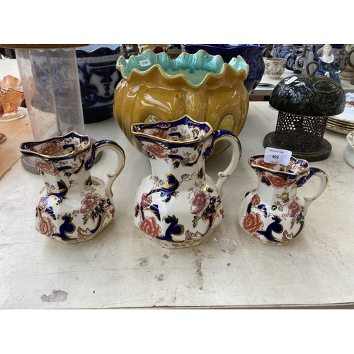 403 - Nine pieces of ceramics to include three Mason's Mandalay jugs, two Mason Cash bird feeders, Bretby ... 