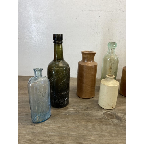 410 - A collection of late 19th/early 20th century stoneware and glass bottles