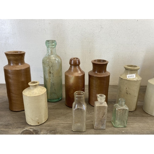 410 - A collection of late 19th/early 20th century stoneware and glass bottles