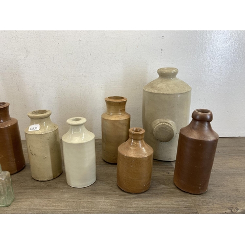 410 - A collection of late 19th/early 20th century stoneware and glass bottles