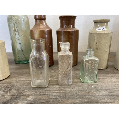 410 - A collection of late 19th/early 20th century stoneware and glass bottles