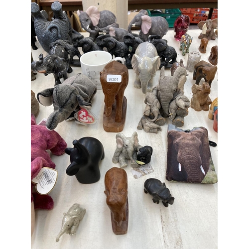 417 - A collection of elephant figurines, paperweights and decorative items to include boxed Objets D'Art ... 