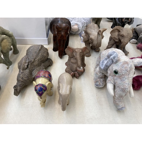 417 - A collection of elephant figurines, paperweights and decorative items to include boxed Objets D'Art ... 