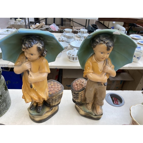 420 - Eight items, two 1930s Umbrella Twins chalkware figurines, two Oldcourt Ware vases, one onyx table l... 