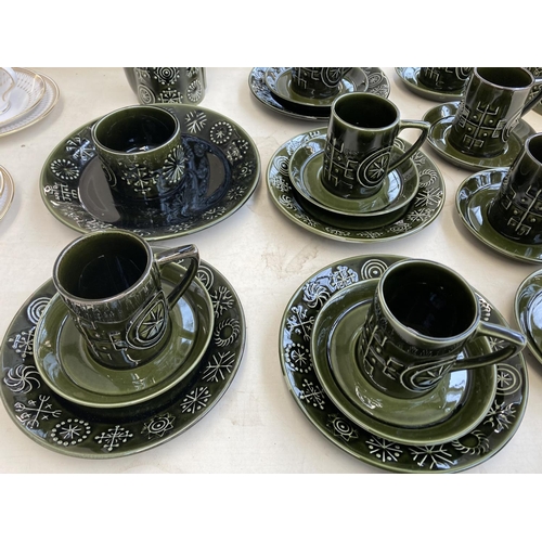 421 - A collection of Portmeirion Totem pattern pottery to include eleven coffee cups, twelve saucers, mil... 