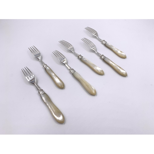 2129 - Six antique hallmarked London silver and mother of pearl dessert forks, three William Hutton & Sons ... 