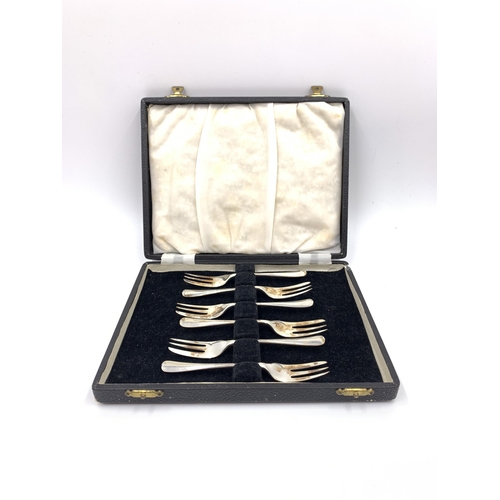 2143 - A cased set of six George VI Thomas Bradbury & Sons Ltd hallmarked Sheffield silver cake forks, date... 