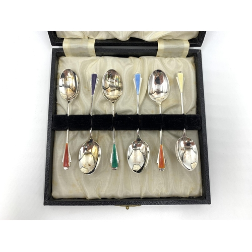 2144 - A cased set of six Elizabeth II James Fenton & Co hallmarked Birmingham silver and enamel coffee spo... 