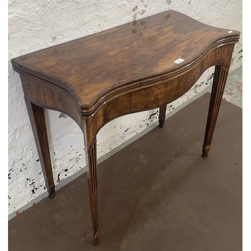 215 - A George III mahogany serpentine fold over tea table - approx. 73cm high x 83cm wide x 42cm deep