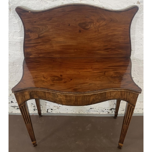 215 - A George III mahogany serpentine fold over tea table - approx. 73cm high x 83cm wide x 42cm deep