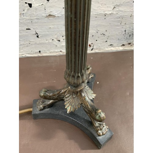 31 - A French Empire style bronzed tri-footed table lamp - approx. 36cm high