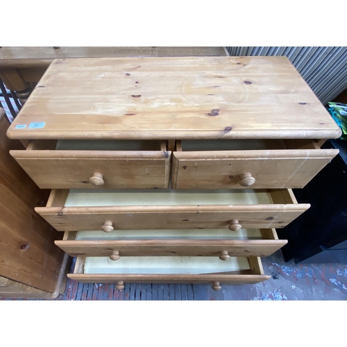 100 - A pine chest of drawers - approx. 74cm high x 84cm wide x 40cm deep