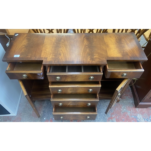 105 - A Bevan Funnell Reprodux mahogany breakfront sideboard - approx. 76cm high x 104cm wide x 36cm deep