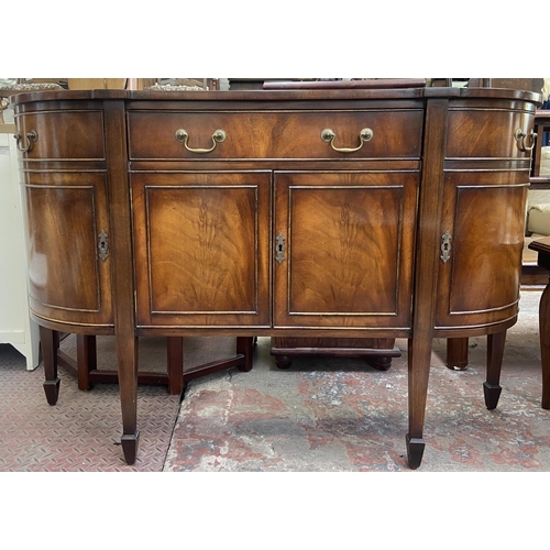 112 - A Bevan Funnell Reprodux mahogany demi lune sideboard on tapering supports - approx. 87cm high x 137... 