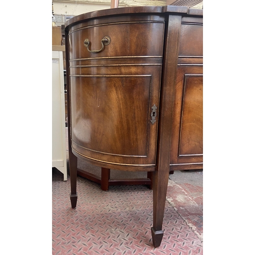 112 - A Bevan Funnell Reprodux mahogany demi lune sideboard on tapering supports - approx. 87cm high x 137... 