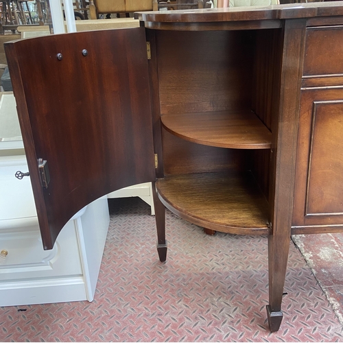 112 - A Bevan Funnell Reprodux mahogany demi lune sideboard on tapering supports - approx. 87cm high x 137... 