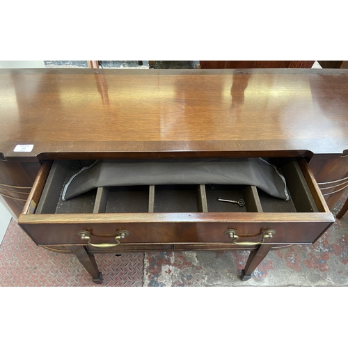 112 - A Bevan Funnell Reprodux mahogany demi lune sideboard on tapering supports - approx. 87cm high x 137... 