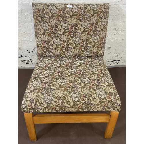 114 - A mid 20th century bentwood and floral fabric upholstered lounge chair