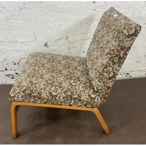 114 - A mid 20th century bentwood and floral fabric upholstered lounge chair