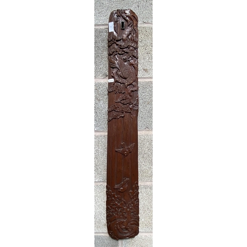 13 - A Chinese carved hardwood wall plaque with bird and foliate design - approx. 98cm high x 14cm wide